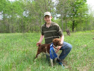 Riley Pitman with his young Brittany, Riley's Magnum Winchester